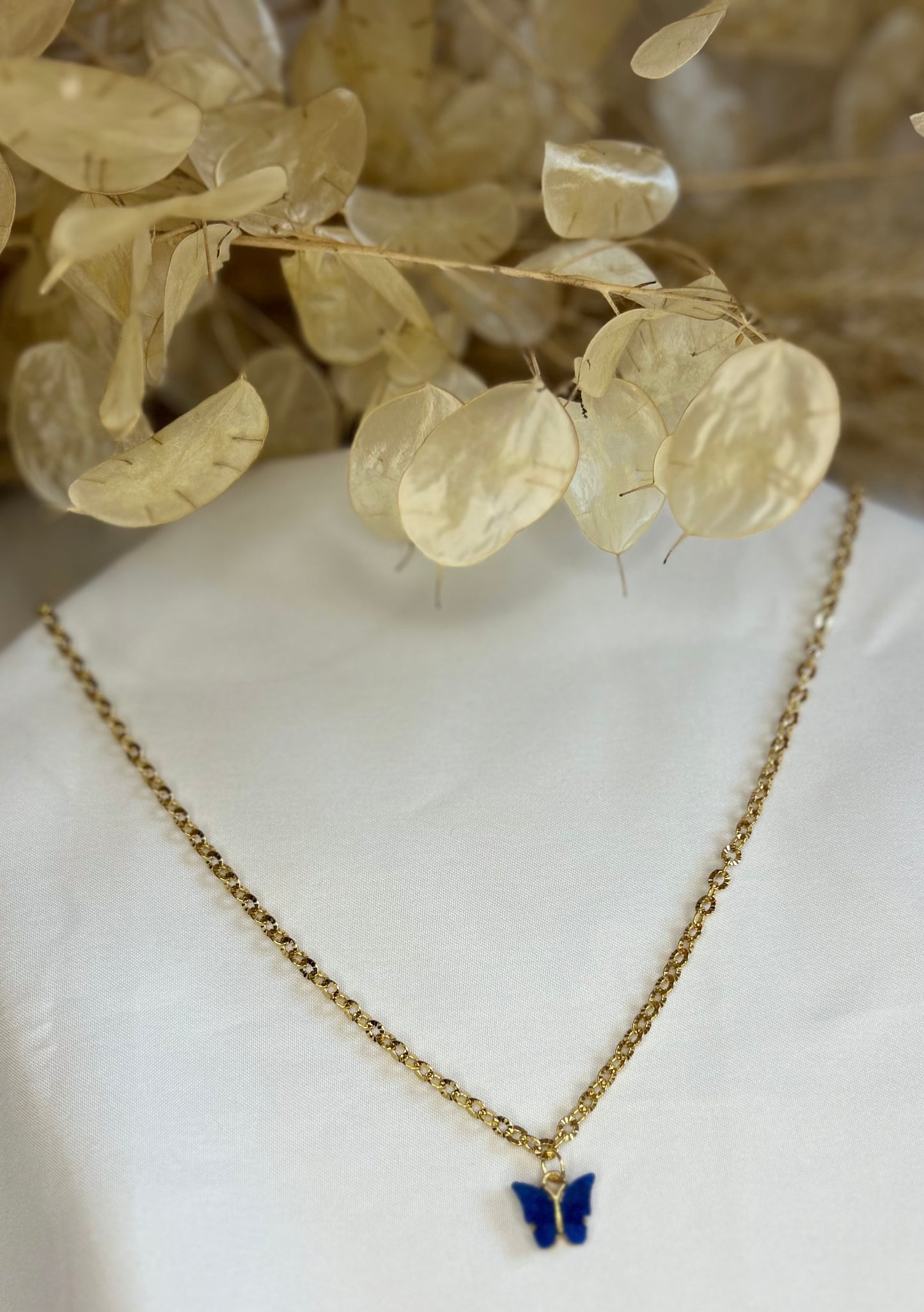 collier papillons solo bleu foncé